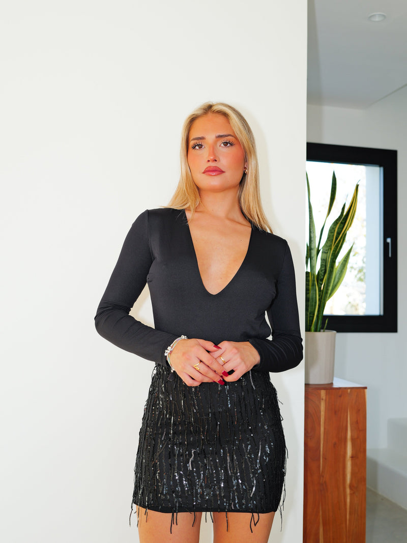 Minijupe noire à franges et paillettes